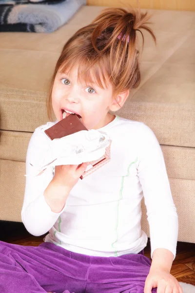 Pretty little girl with chocolate — Stock Photo, Image