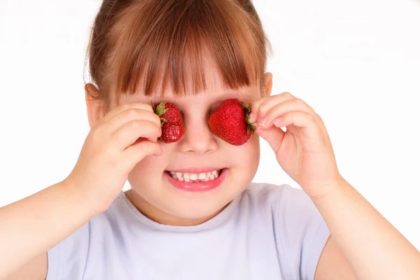 Funny little girl with strawberries — Stock Photo, Image