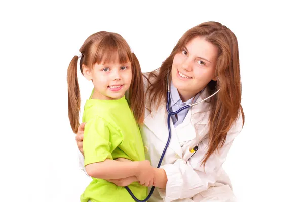 Young medical doctor woman inspects beautiful little girl — Stock Photo, Image
