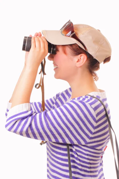 Beautiful young girl looking through binoculars — Stock Photo, Image