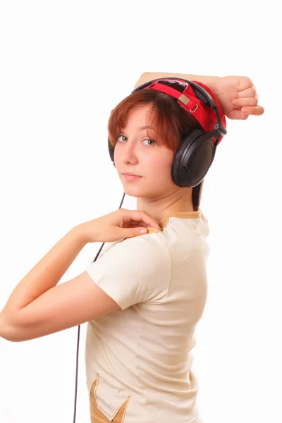 Krásná mladá dívka se sluchátky — Stock fotografie