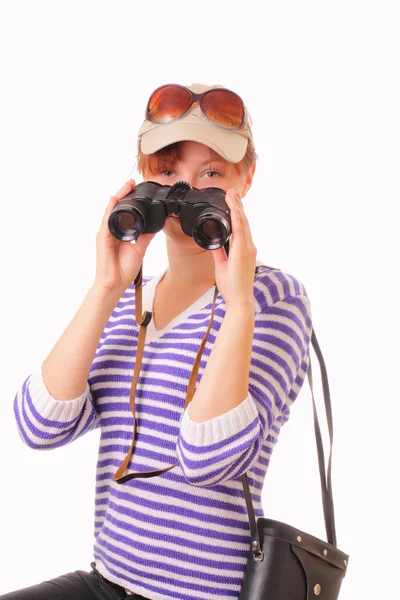 Pretty young girl with binoculars in her hands — Stock Photo, Image