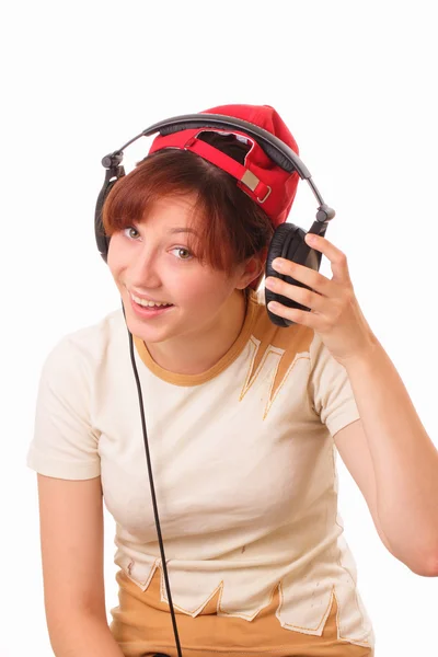 Usměvavá mladá dívka se sluchátky — Stock fotografie