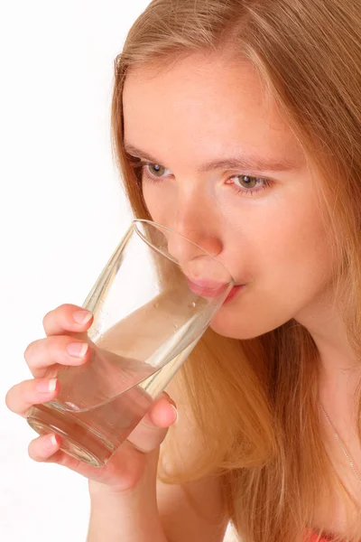 Beautiful young woman drinking water from the glass — Stock Photo, Image