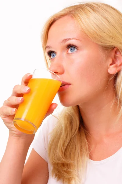 Beautiful young woman drinking juice — Stock Photo, Image