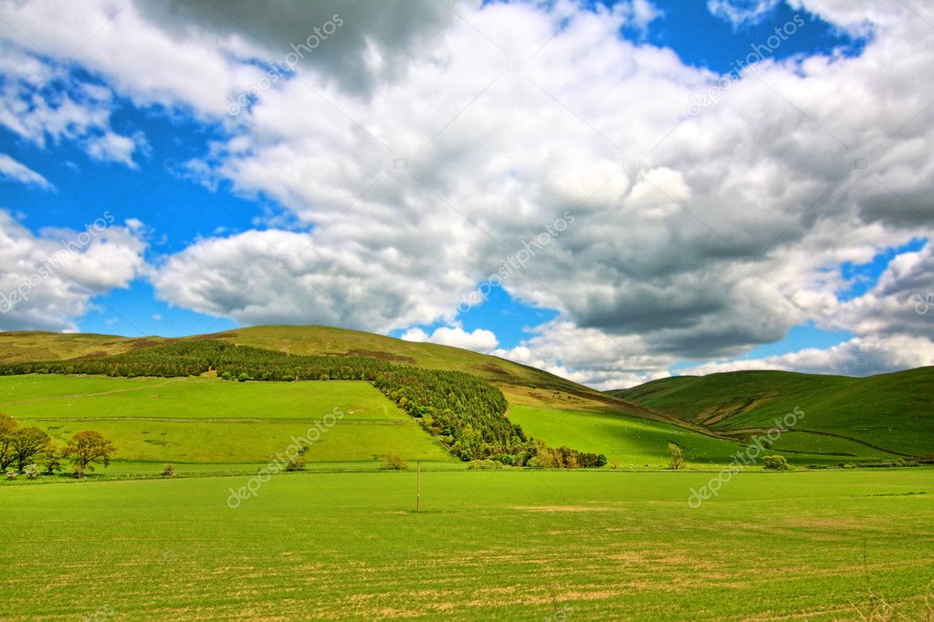 Scottish Spring landscape with hills and white clouds