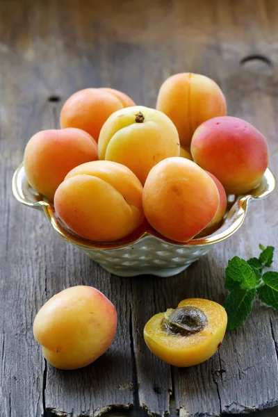 Group ripe juicy fruit apricot on a wooden table, rustic style Stock Picture