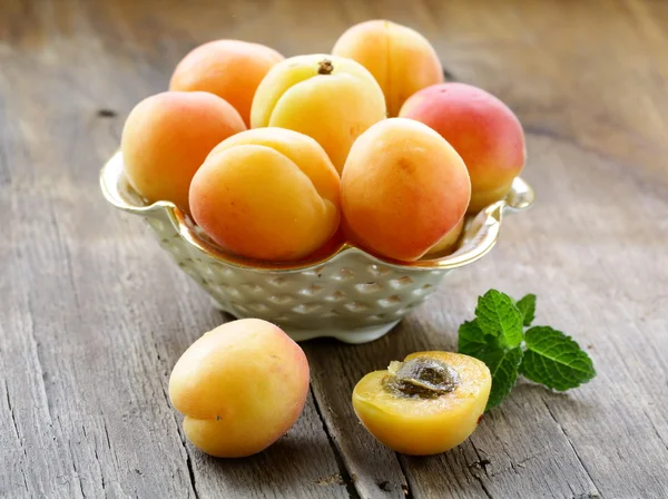 Group ripe juicy fruit apricot on a wooden table, rustic style Royalty Free Stock Photos
