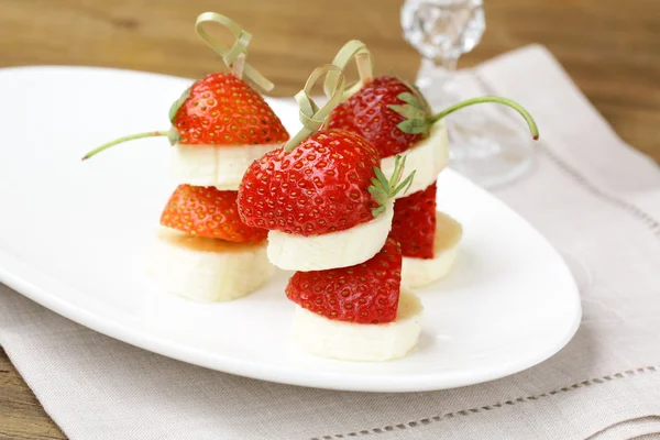 Dessert of strawberries and bananas, mini snack — Stock Photo, Image