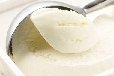 Creamy vanilla ice cream in a white cup clipart