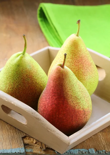 Three ripe juicy pear on a wooden table — Stock Photo, Image