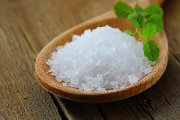White large sea salt in a wooden spoon — Stock Photo, Image