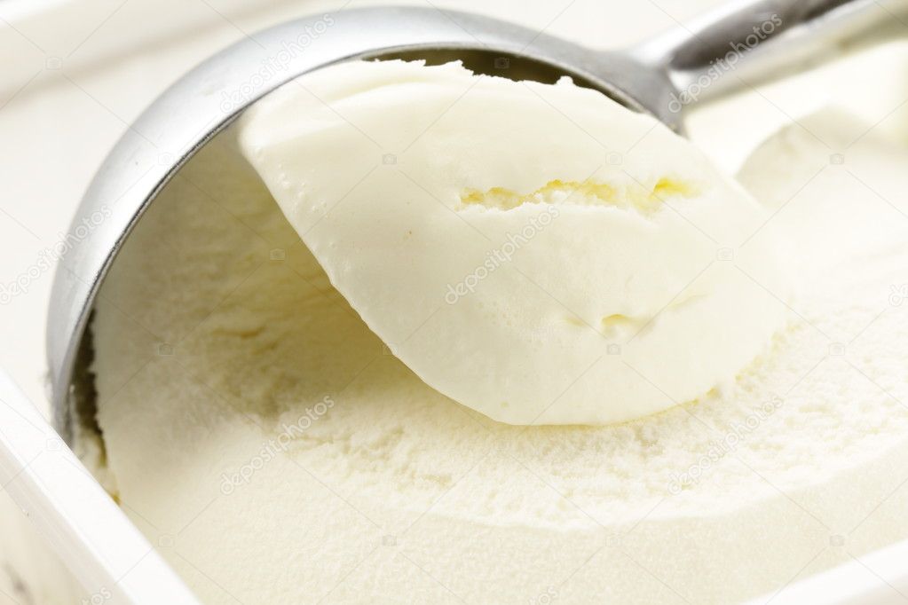 Creamy vanilla ice cream in a white cup