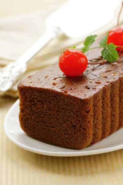 Chocolate birthday cake with cherries and mint — Stock Photo, Image