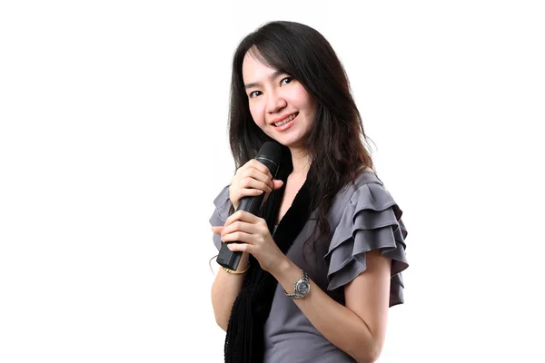 Karaoke-Sängerin auf weißem Hintergrund. — Stockfoto
