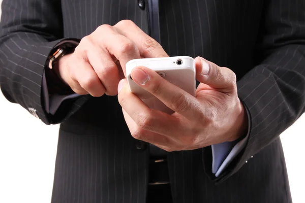 stock image Businessman using a mobile phone on the white background