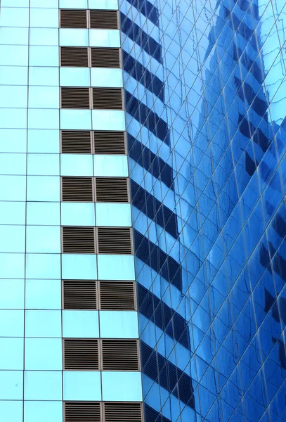 Highrise glass building with sky reflection — Stock Photo, Image