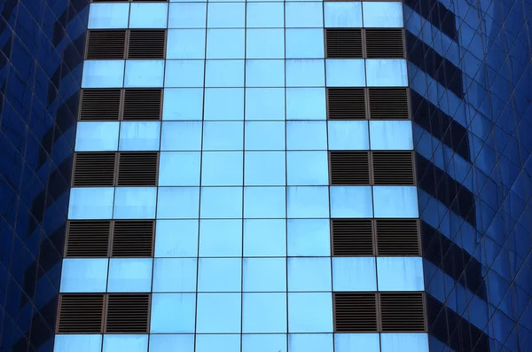 Highrise glass building with reflection — Stock Photo, Image