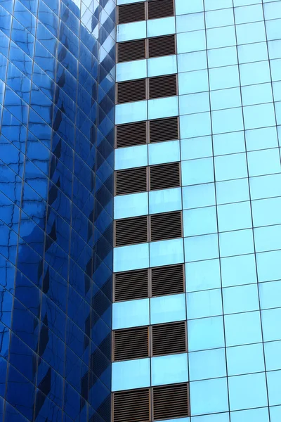 Highrise glass building with reflection — Stock Photo, Image