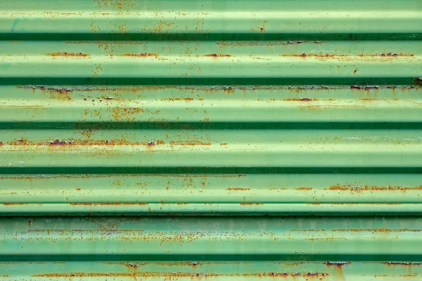 Rostige Metalloberfläche in grün lackiert — Stockfoto