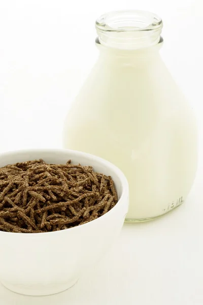 stock image Wheat bran cereal breakfast with pint glass milk bottle