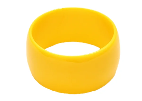 白い背景の上の黄色のプラスチックの腕輪 — ストック写真