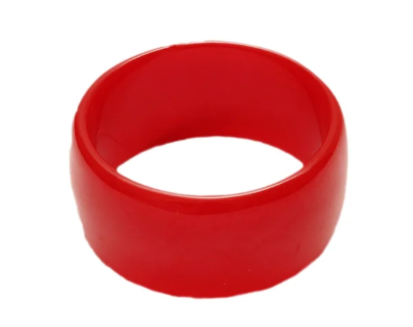 Красный пластиковый браслет на белом фоне — стоковое фото