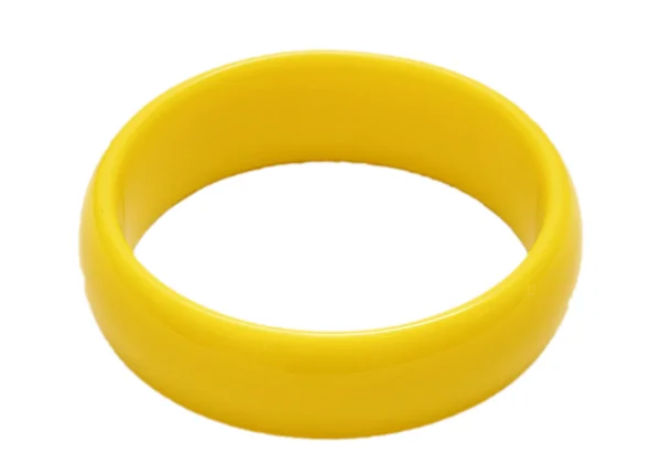 Žluté plastové náramky na bílém pozadí — Stock fotografie
