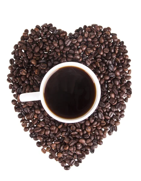 Heart of the coffee beans with a cup of coffee in the heart on a white background