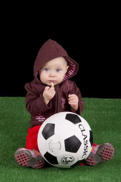 Baby with a soccer ball — Stock Photo, Image