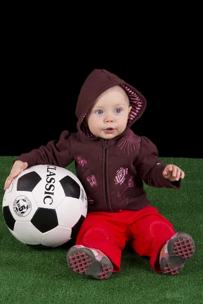 Bebê com uma bola de futebol — Fotografia de Stock