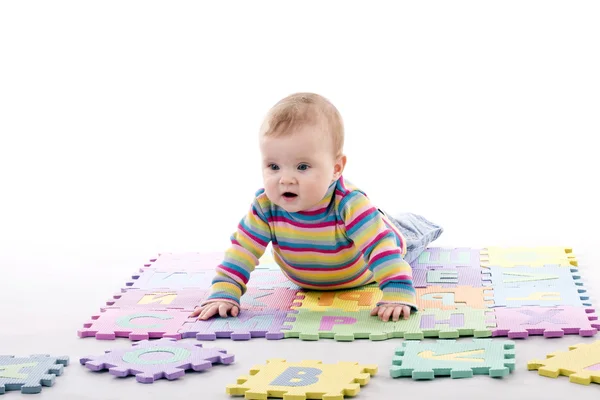 Kid with letter puzzle — Stock Photo, Image