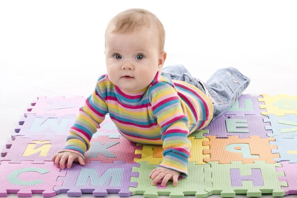 Kid with letter puzzle — Stock Photo, Image