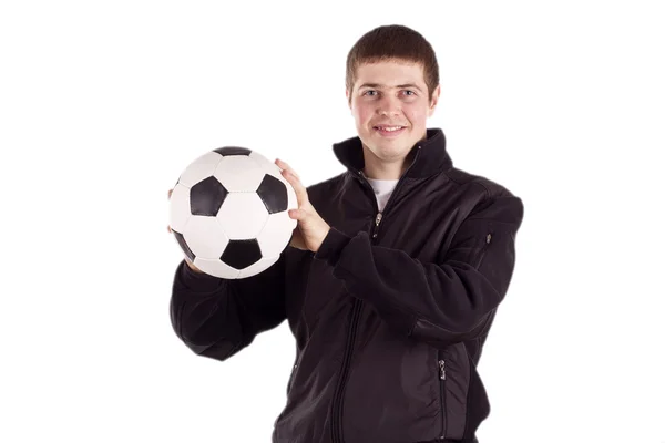 Joven sosteniendo una pelota de fútbol —  Fotos de Stock