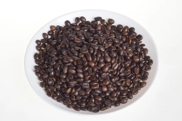 A plate with coffee beans — Stock Photo, Image
