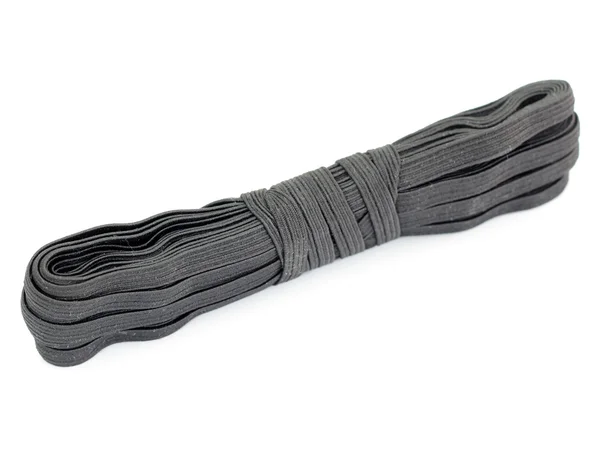 Naaien zwarte rubber op een haspel. — Stockfoto