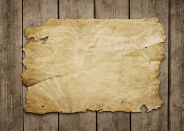 Old paper at grunge wooden background clipart