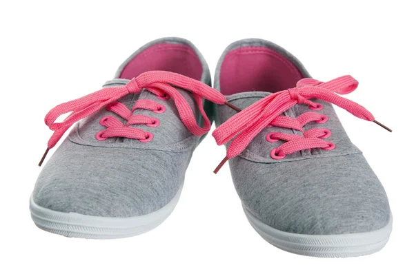 Vackra kvinnliga rosa sneakers, det är isolerade på vit — Stockfoto