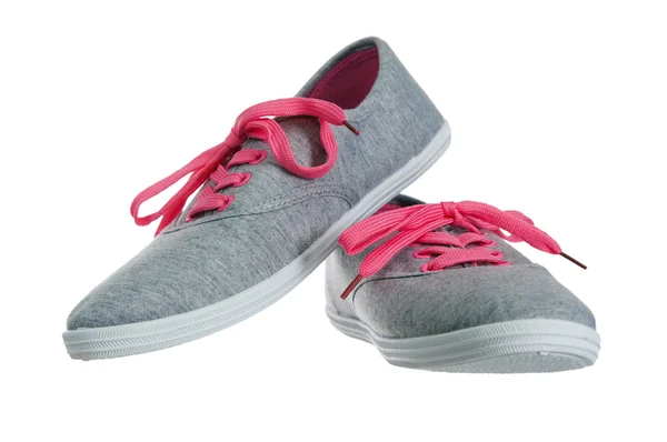 Hermosas zapatillas de deporte de color rosa femenino, está aislado en blanco —  Fotos de Stock