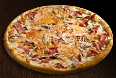 Pizza prosciutto e funghi with ham and mushrooms - isolated clipart