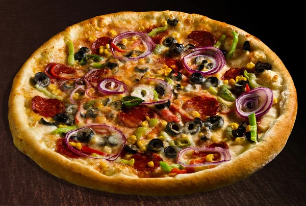 Pizza messicana with pepperoni, hot chili pepper, bell pepper, corn, olives and onion - isolated