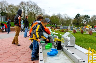 THE HAGUE, NETHERLANDS - APRIL 7: Visiting tourists Madurodam ex clipart