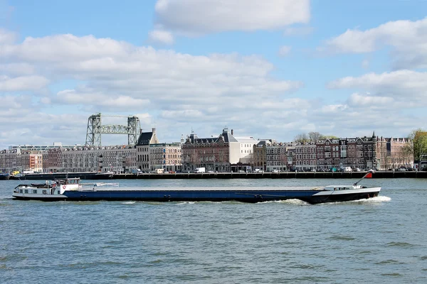 Barge on backdrop of waterfront of Rotterdam. Netherlands — Stock Photo, Image