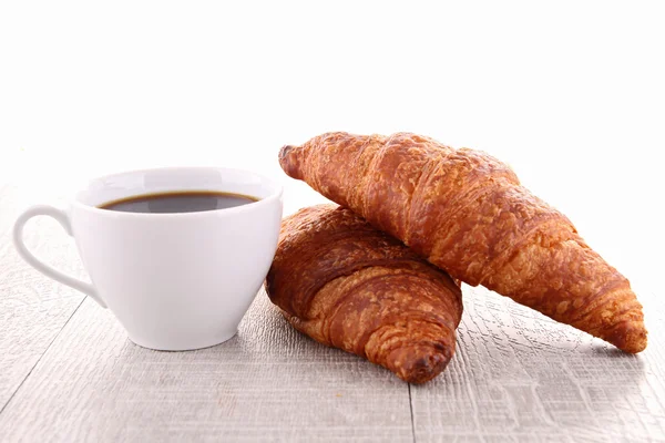 Coffee cup and croissant — Stock Photo, Image