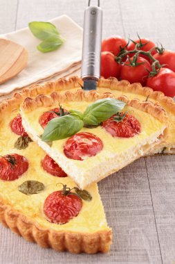 Gourmet tomato quiche and basil clipart