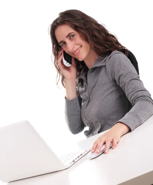 Businesswoman with phone and computer — Stock Photo, Image