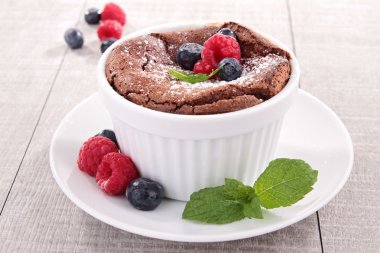 Chocolate souffle with berries fruits clipart