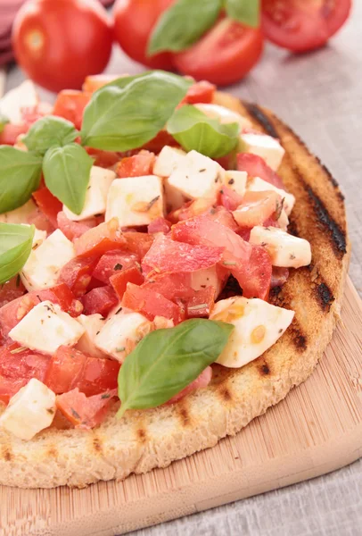 Tomato,mozzarella and basil bruschetta — Stock Photo, Image
