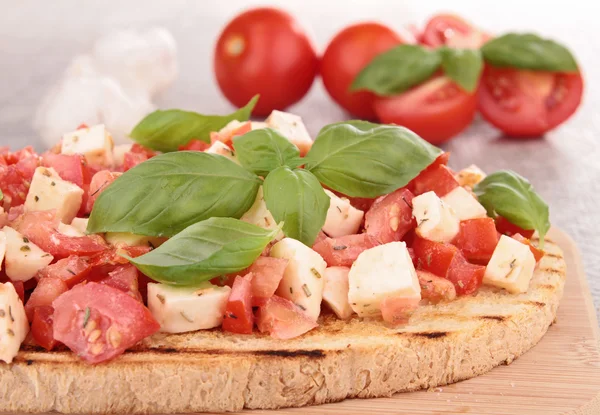 Tomato,mozzarella and basil bruschetta — Stock Photo, Image