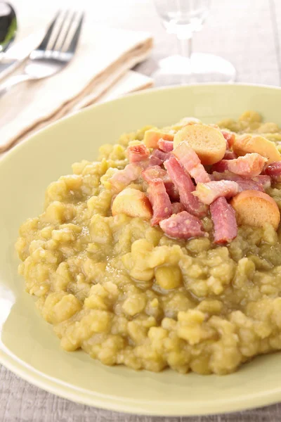 stock image Bowl of split pea soup and bacon